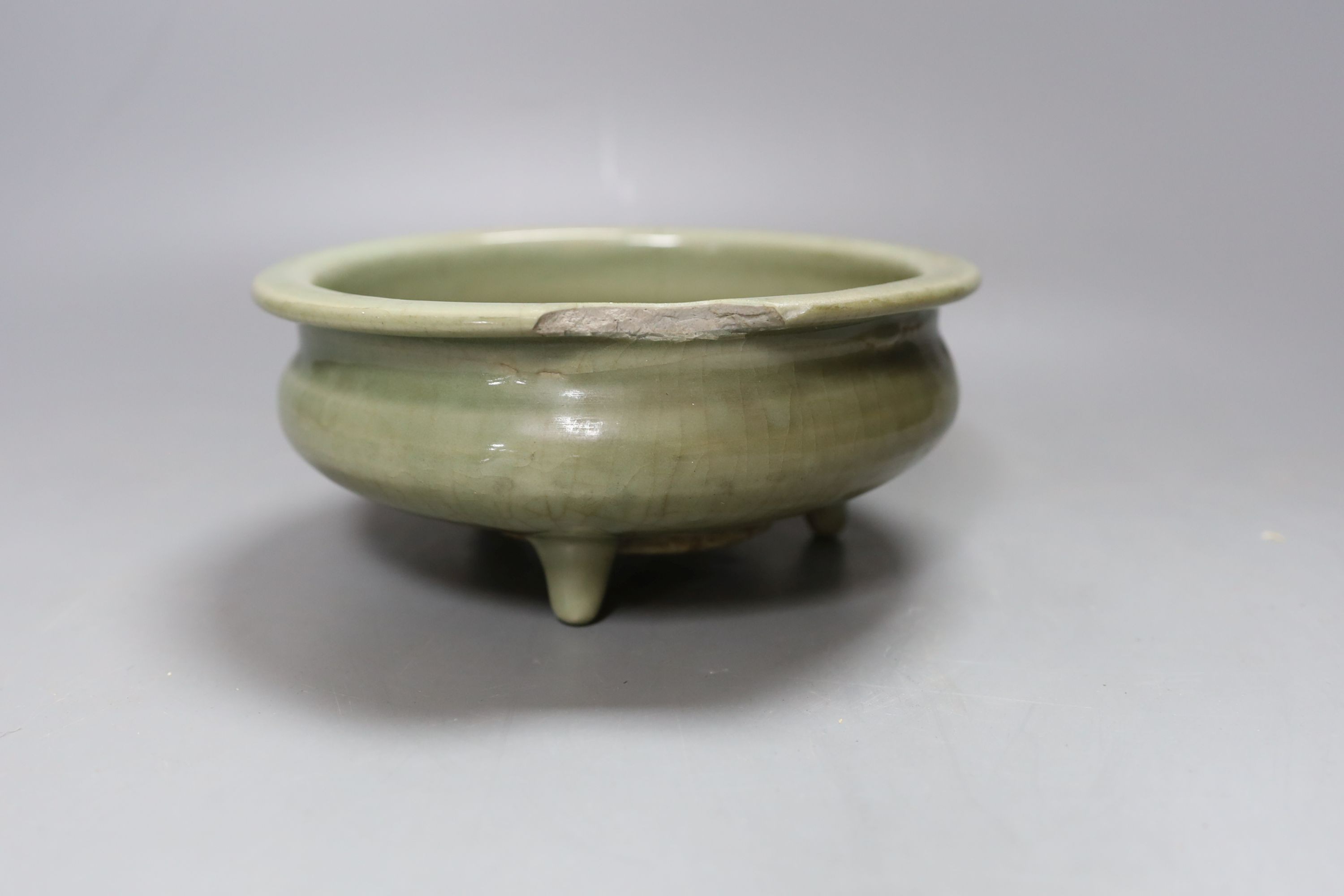 A Chinese Ming Longquan celadon tripod censer, 14th/15th century - 8cm tall